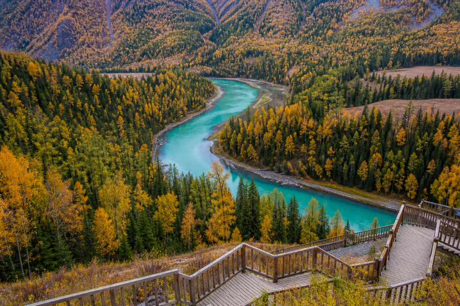 Moon Bay in Kanas Lake Scenic Area with forest river bend Moon Bay in Kanas Lake Scenic Area with forest river bend