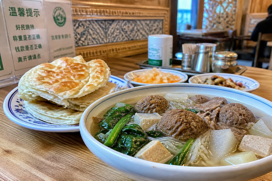 Xinjiang Meatball Soup served with oil tower bread in a traditional Urumqi halal restaurant