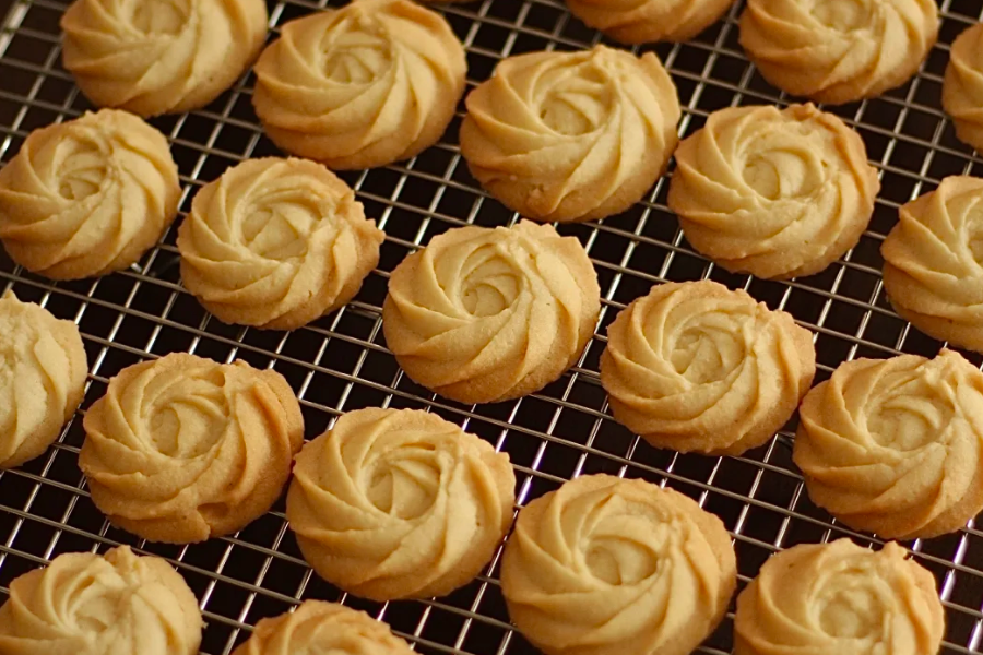 Milk cookies in Xinjiang displayed as travel snack with rich dairy texture and simple packaging