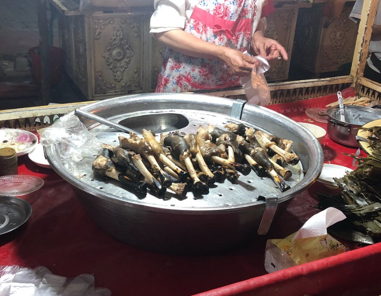 Outdoor dining and local evening atmosphere at Kashgar Night Market near Kashgar Old City Outdoor dining and local evening atmosphere at Kashgar Night Market near Kashgar Old City