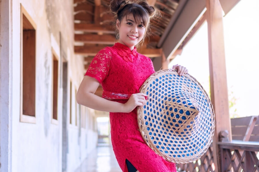 Traveler wearing Qipao historical district blending modern and traditional style
