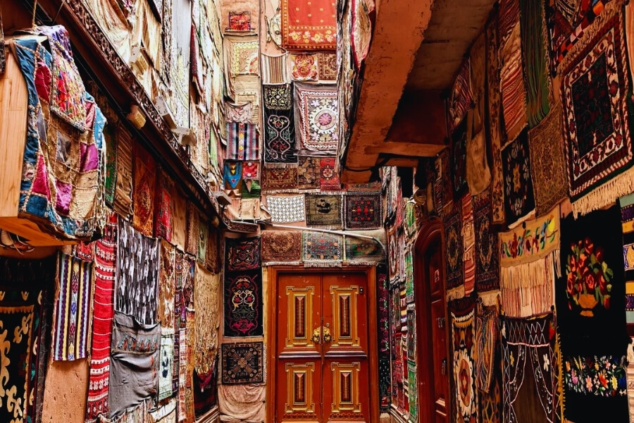 Travelers experiencing Silk Road culture in Kashgar ancient city reflecting Year of the Goat cultural journey